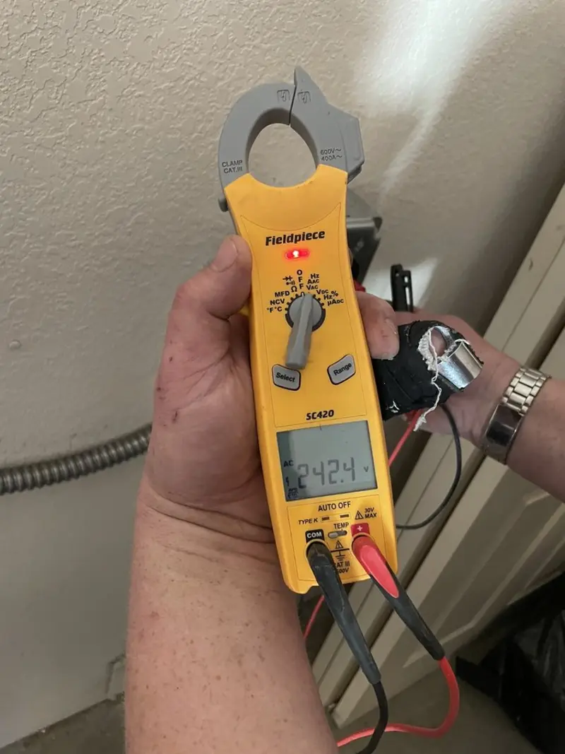 Voltage testing with clamp meter during Electrical Installation Services in Terre du Lac